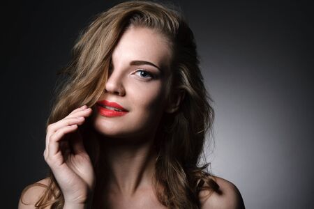 Beautiful caucasian young woman with red lips make upの写真素材