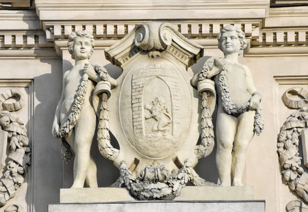Opera and Ballet Theatre in Lviv. Sculpture boys geniuses that hold the shield with the arms of the city of Lviv.の写真素材