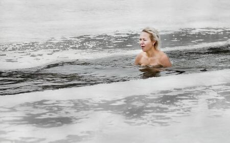 Healthy lifestyle. Courage, courage, activity. Swimming in the ice-hole on Epiphanyのeditorial素材