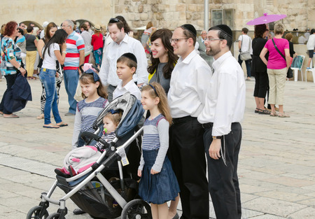 Jerusalem, the old city. Jewish Family is photographed at the shrine of Judaism - Wailing Wallのeditorial素材