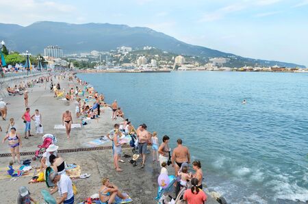 Many people on the waterfront near the sea in the city of Yalta. Crimea, Ukraine. Summer 2012のeditorial素材