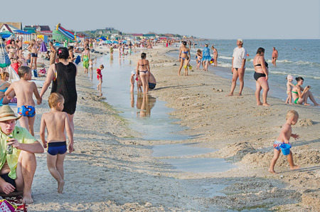 Sea of Azov. Many people on the sea beach in the village Kirilovka. Ukraine. Summer 2013のeditorial素材
