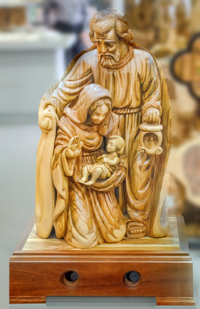 A family. Joseph and the Blessed Virgin Mary with the baby Jesus Christ in her arms. Statuette in Bethlehem city store, Palestine.の写真素材