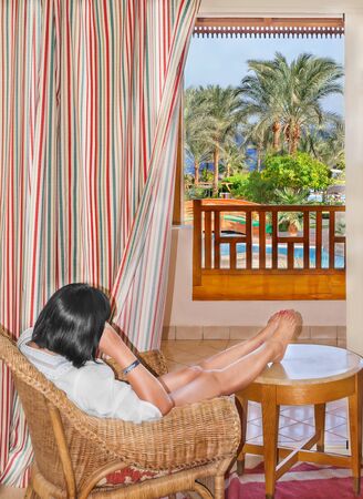 Woman sitting at the window and admires exotic nature, landscape Egyptの写真素材