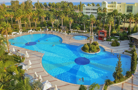 Relax in the Turkish hotel. Large swimming pool, palm trees, park recreation area. Kemer, Turkeyのeditorial素材