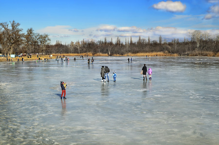 Winter rest. People walk on the frozen ice of the river Samara. Ukraine city Novomoskovsk Dnipropetrovsk region. February 07, 2016のeditorial素材