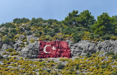 Turkish flag painted in the mountain town of Phoenicia, Antalya. Turkey.の写真素材