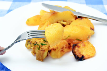 slices of fried potato with pork.の写真素材