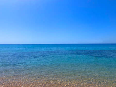 Fabulous blue sea stretching over the horizon and the coast. Ocean.