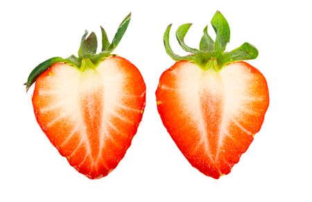 Red fresh ripe delicious cut strawberry with green leafの写真素材