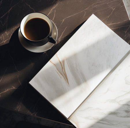 coffee cup with book on wooden table.の素材