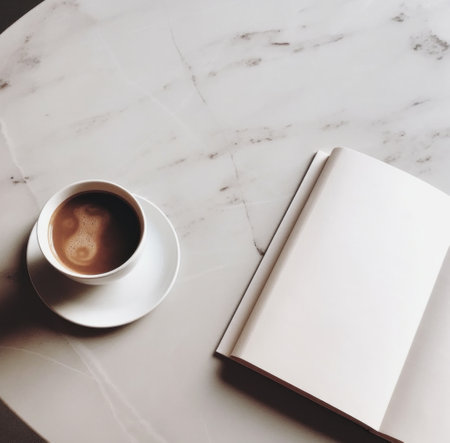 coffee cup with book on wooden table.の素材