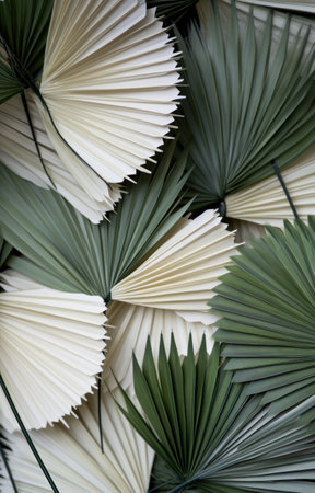 palm leaves in shades of green with white stems.の素材