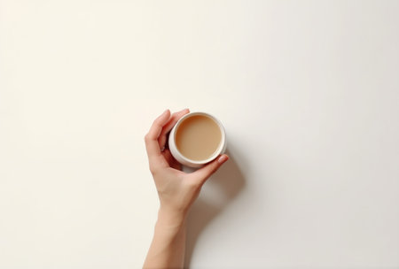 women hands holding a cup of tea.の素材
