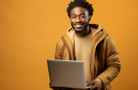 a black man is holding a laptop laptop,の素材