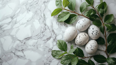 a bunch of green leaves surrounding Easter eggs over a marble counter,.の素材