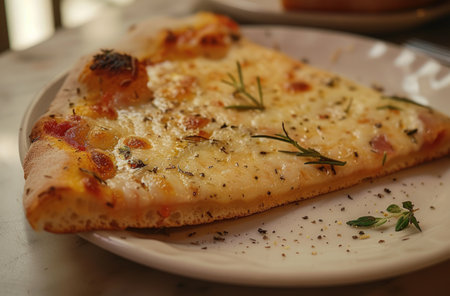 a slice of pizza with herbs in it.の素材