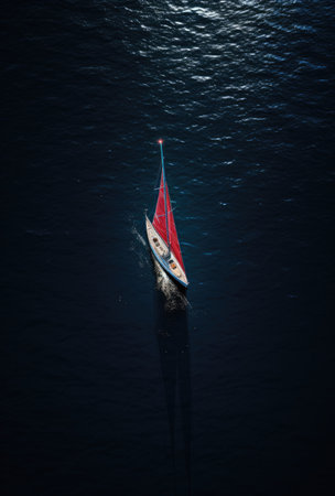 a photo of a sailboat floating through the water.の素材