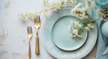 a plate and cutlery are at the top of a stone table.の素材