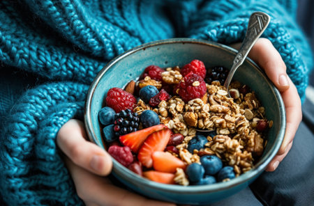 eating a bowl of healthy nuts and fruit.の素材