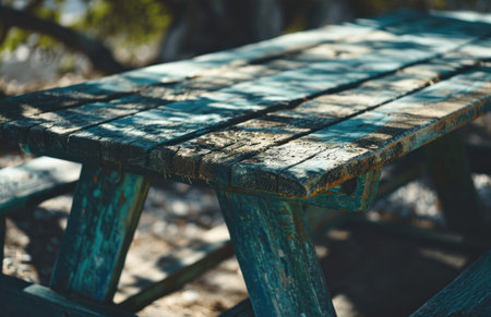 an old picnic table is set outside.の素材