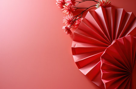 Chinese new year, decoration of paper flower fan with traditional flora in pink background.の素材
