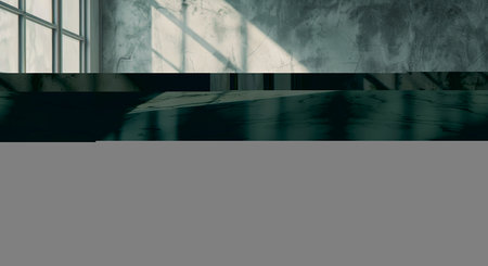 A room devoid of furniture, featuring a spacious window and polished marble flooring. Sunlight streams in through the window, casting shadows on the pristine surface.の素材