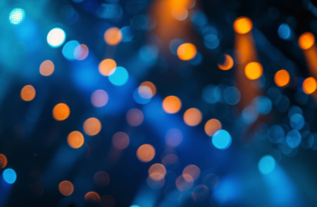 A collection of bright stage lights casting a dazzling glow across a performance area on a stage. The lights create a vibrant and dynamic atmosphere as they illuminate the space for the performers.の素材