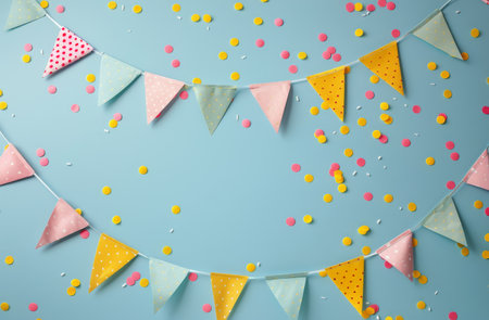 Bright yellow and pink paper buntings are strung across a vibrant blue background, adding a colorful and festive touch to the scene. The cheerful decorations create a lively atmosphere with their bold colors and playful shapes.の素材