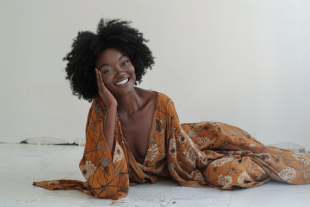 A female individual laying down on the ground while placing her hand on her head in a gesture of distress or discomfort. The woman appears to be physically experiencing or emotional pain, with a look of distress on her face.の素材
