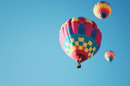 Hot Air Balloon Adventure. Colorful balloons soaring against a clear sky.の素材