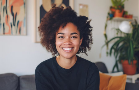woman smiling in living room.の素材