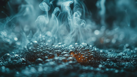 Detailed close-up of swirling smoke mixing with water droplets on a dark black backdrop.の素材