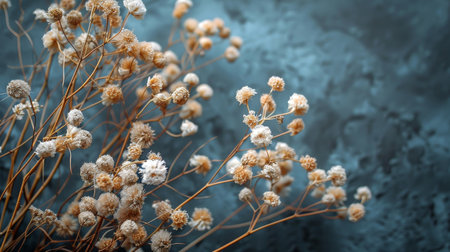 Several colorful flowers hanging on a white wall, adding a vibrant touch to the space.の素材