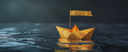 A yellow origami boat peacefully floats on the calm water surface.の素材