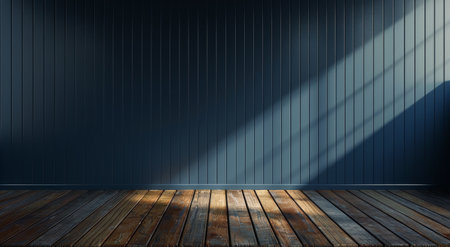 A wide shot of an empty room with dark blue paneling walls, sunlight shining in from a window, illuminating the wooden floor.の素材