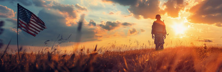 A soldier stands in a field at sunset, silhouetted against the vibrant sky. An American flag waves in the distance.の素材