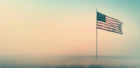 Two small American flags stand proudly on a table with a blurred background, symbolizing patriotism and national pride.の素材