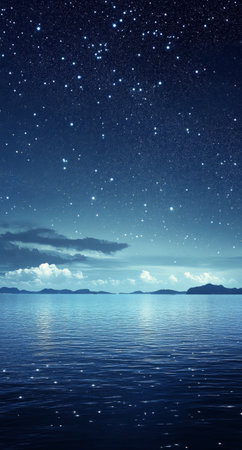 A vast night sky sparkles with stars, accompanied by ethereal clouds, above calm waters reflecting the fading twilight and silhouetted mountains in the distance.の素材