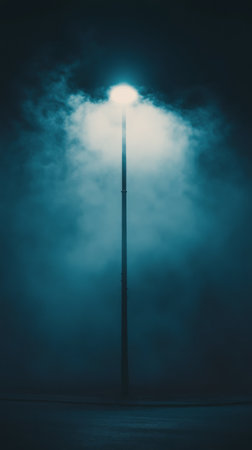 Dark clouds fill the sky, partially obscuring a bright moon. The light breaks through the clouds, casting a mystical glow on the surrounding atmosphere during the nighttime.の素材