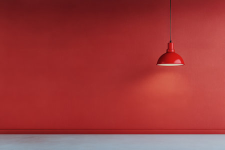 A striking red lantern hangs from the ceiling, casting a warm glow over a smooth red wall, complemented by delicate cherry blossom branches placed nearby, creating a harmonious decor.の素材