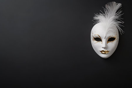 A beautifully crafted white mask adorned with gold decorations and elegant feathers is situated on a dark background. The artwork highlights intricate designs that capture attention.の素材