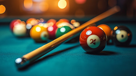 A vibrant pool table features colorful billiard balls arranged in a triangular formation, illuminated by soft lighting in a casual setting.の素材