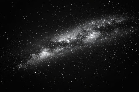A mesmerizing expanse of deep blue space filled with twinkling stars and luminous galaxies, showing the beauty of the universe at night.の素材