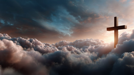 Golden light breaks through clouds at sunrise, illuminating a tall cross. The sky is filled with soft hues of orange and blue, evoking a tranquil and spiritual atmosphere.の素材