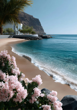 Gentle waves lapping at the shore create a tranquil atmosphere on this sandy beach adorned with pink flowers. The clear blue water meets the cliffside under sunny skies.の素材