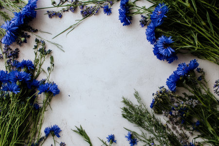 Vibrant blue flowers surround a light, textured surface, creating a fresh and inviting atmosphere. Ideal for enhancing natural beauty in home decor or craft projects.の素材