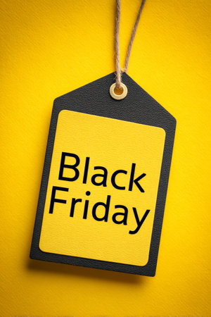 Bright yellow tag showcases bold Black Friday text, symbolizing the excitement of holiday shopping and discounts. Perfect for highlighting seasonal promotions and sales events.の素材