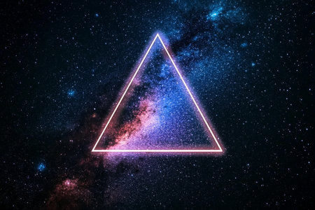 A glowing triangle shape appears in the vast dark space filled with sparkling stars and cosmic dust, creating a surreal and ethereal atmosphere that captivates the viewer.の素材