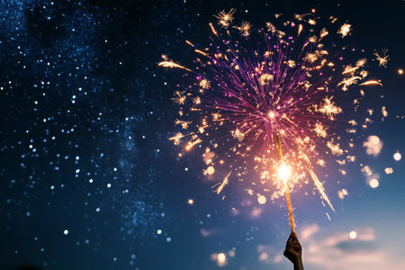 Bright fireworks light up the night sky, creating a vibrant display of colors above a tranquil landscape. The bursts reflect excitement and celebration during a summer evening..の素材